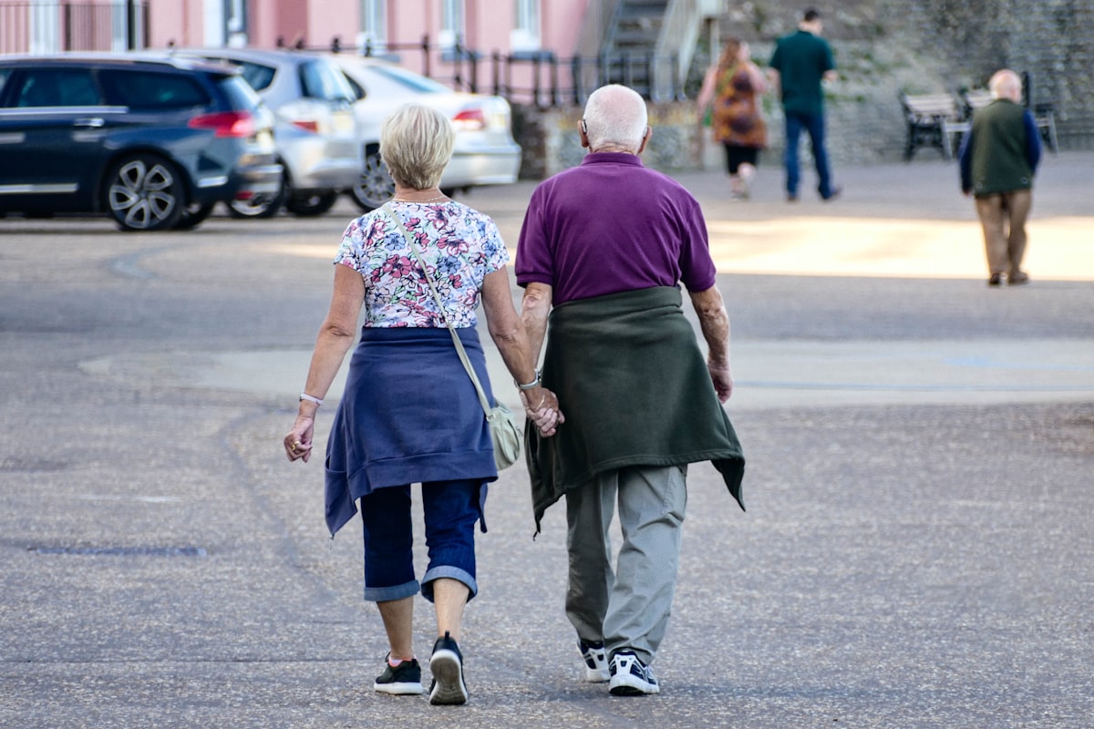 Active older adult walking outdoors, bone strength and osteoporosis